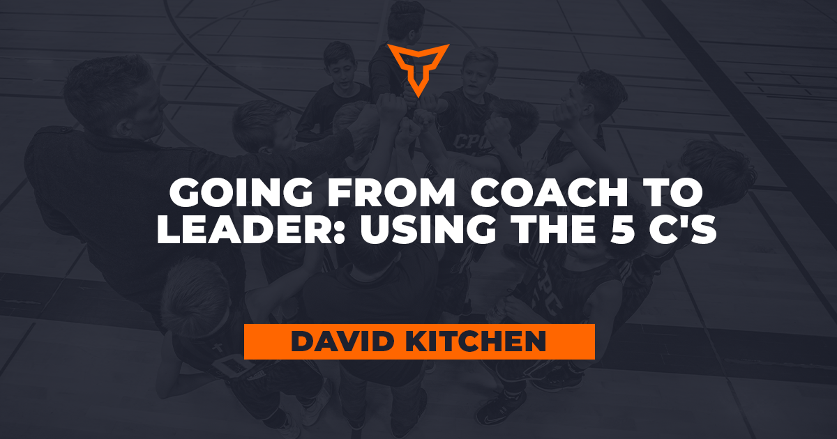 A coach and a team of young basketball players